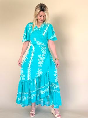 Vestido cruzado largo color turquesa con estampado floral